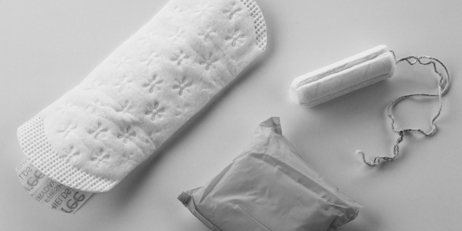 Pantyliner, packed sanitary pad and tampon, close up.